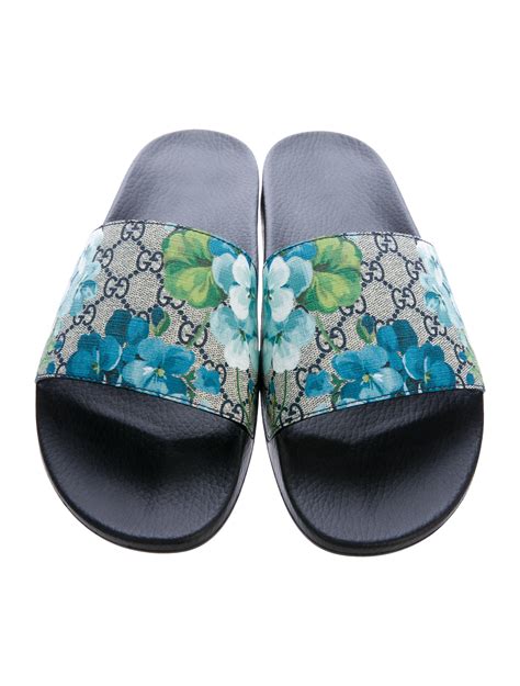 blue blossom gucci slides|Gucci slides with blue flowers.